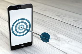 45968879 - digital generated mobile marketing and targeting. smartphone with dartboard in the screen.